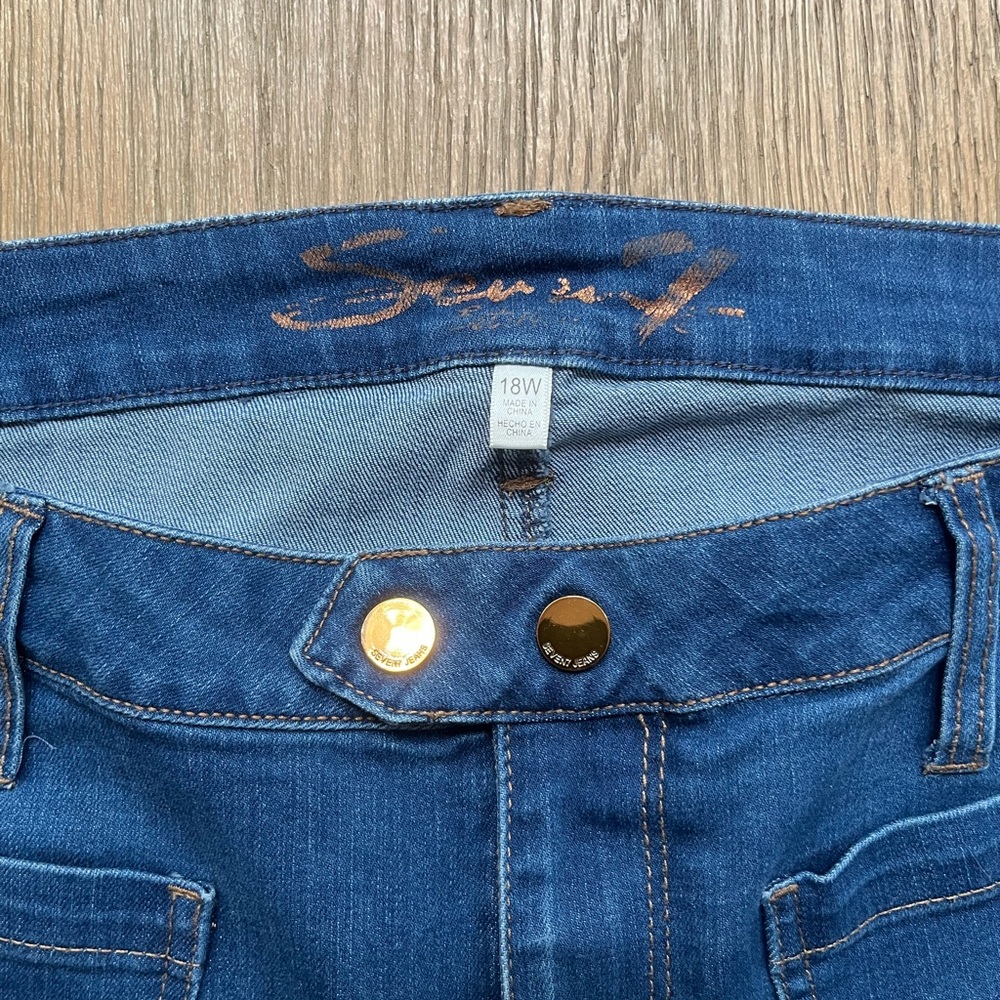 Signature Blue Jeans with Distressed Details and Gold Stitching